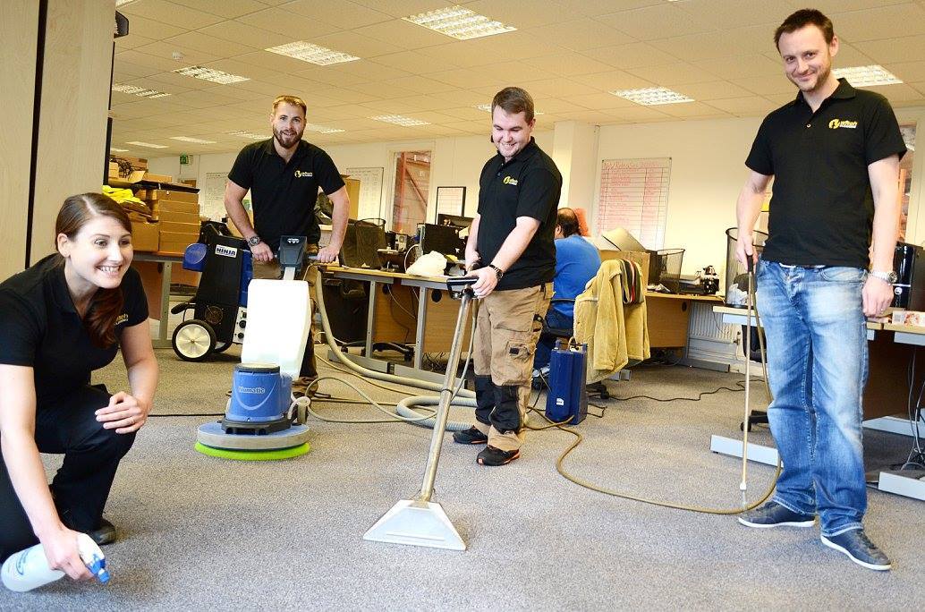 This is a phot of the K&S Carpet Cleaning team cleaning a commercial office together